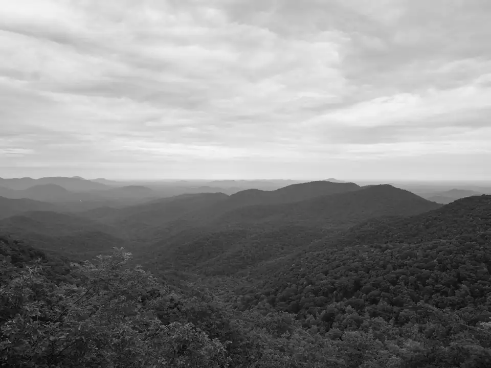 Black-and-white view of forested ridges receding to a hazy horizon in the Blood Mountain Wilderness