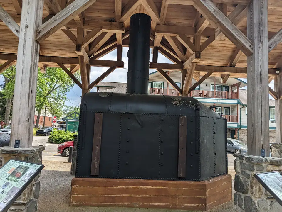 The Chestatee River Diving Bell, a gold-dredging bell from about 1875, under a timber pavilion in Dahlonega