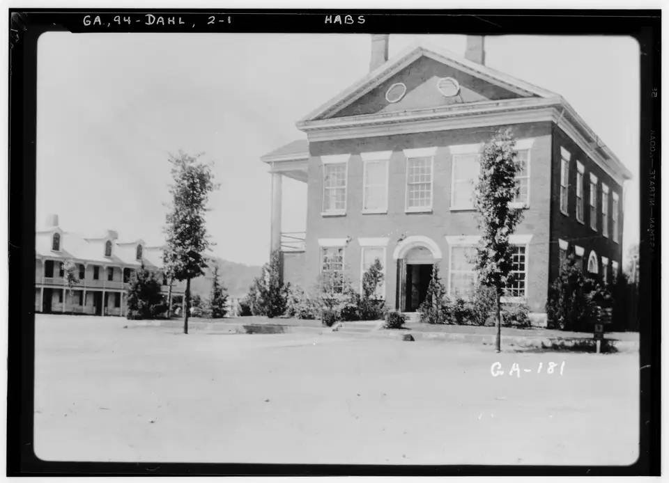 1936 survey photograph of the 1836 Lumpkin County Courthouse on the unpaved Dahlonega square