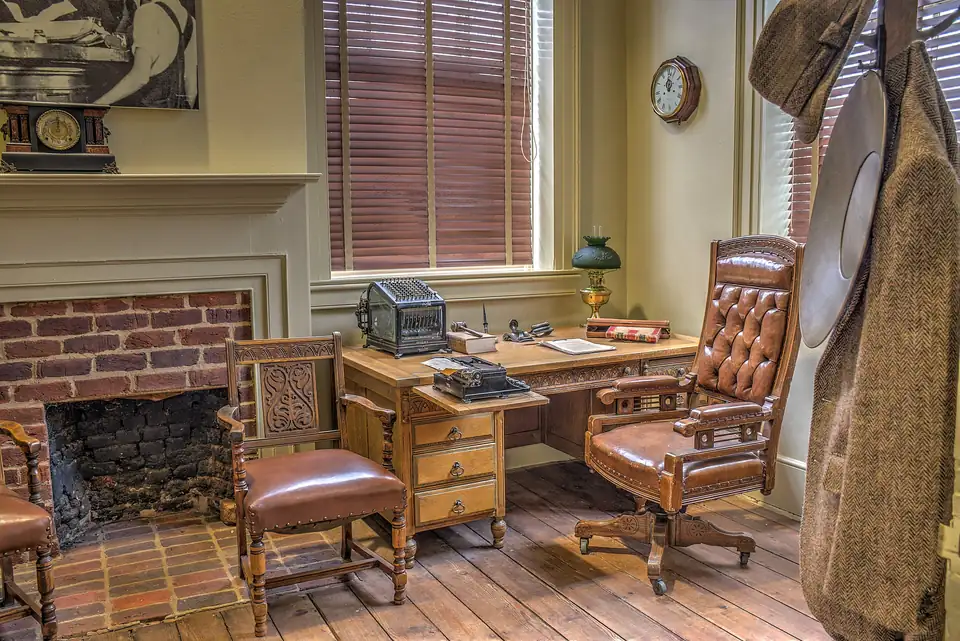 Judge's chamber inside the 1836 courthouse: oak desk with typewriter and law book, leather chair and fireplace